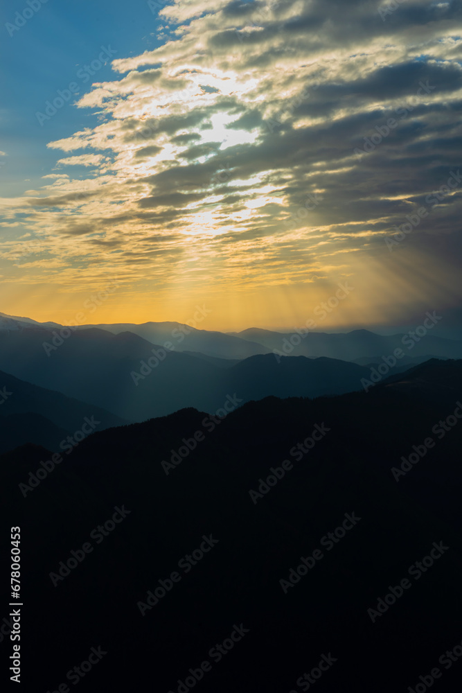 Rays of sunlight reflected from the clouds to the mountains.Rays of sunlight reflected from the clouds to the mountains. Sunset Colorful images in the mountains. View of Kackar mountains from Huser P