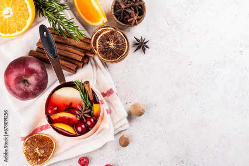Hot mulled wine with fruits and spices. Autumn or winter warm drink