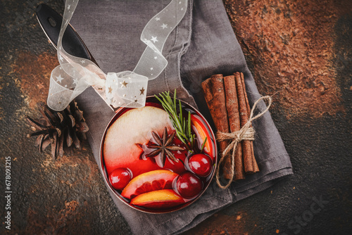 Hot mulled wine with fruits and spices. Autumn or winter warm drink