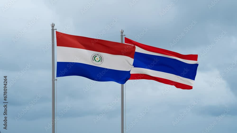 Kingdom of Thailand and Paraguay flag waving together on cloudy sky, endless seamless loop, two country cooperation concept Kingdom of Thailand and Paraguay flag waving together on cloudy sky, endless seamless loop, two country cooperation concept