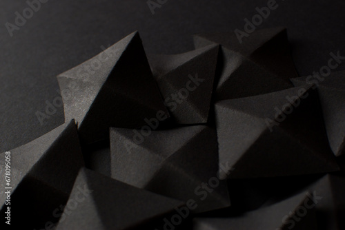 Black abstract background with geometric shapes  close up