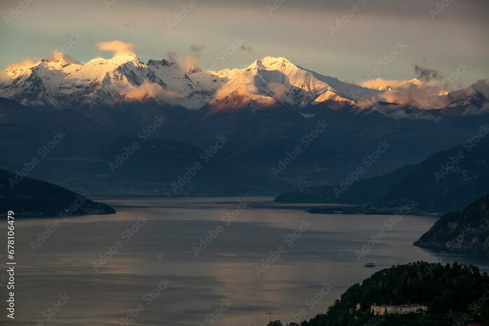 incredible sunset of the snowy mountains of lake di como in italy