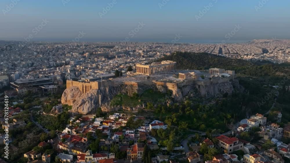 Aerial view of the skyline of Athens, Greece, with Acropolis, the Parthenon Temple and the old town Plaka during golden sunrise Aerial view of the skyline of Athens, Greece, with Acropolis, the Parthenon Temple and the old town Plaka during golden sunrise