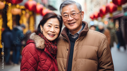 Old couple with Chinese traditional clothing  celebrating Chinese new year