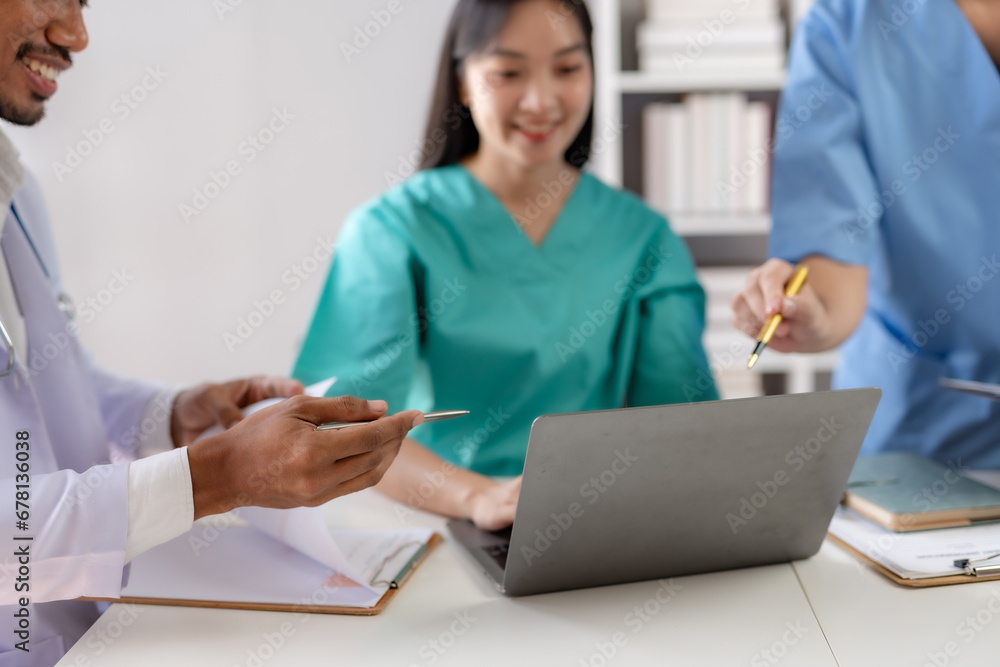 Doctor discussing diagnosis during the meeting. Group of doctor discussing work matter in the office at work. The medical team discusses treatment options with the patient. Doctor discussing diagnosis during the meeting. Group of doctor discussing work matter in the office at work. The medical team discusses treatment options with the patient.