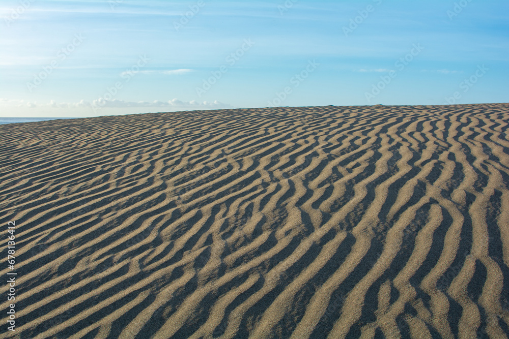 Landscape with sand pattern and blue sky Landscape with sand pattern and blue sky
