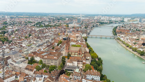 Basel, Switzerland. Basel Cathedral. Basel is a city on the Rhine River in northwestern Switzerland, near the borders with France and Germany, Aerial View © nikitamaykov