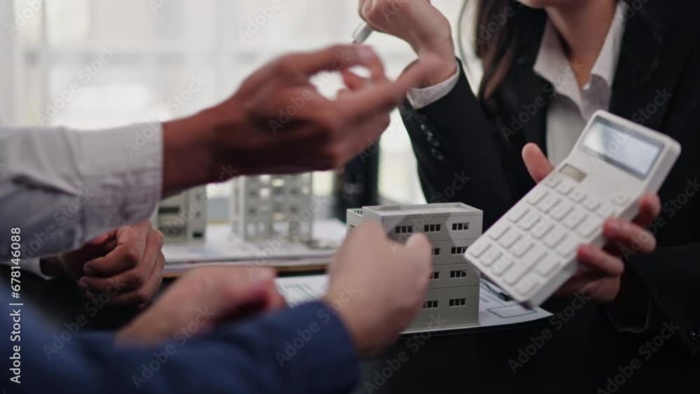 Business people selling, buying or mortgage and signing agreement paperwork for loan financial to buying apartment house properties. Business people selling, buying or mortgage and signing agreement paperwork for loan financial to buying apartment house properties.