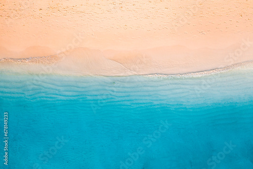 Relaxing aerial beach scene. Summer vacation holiday landscape banner. Waves surf crash amazing blue ocean lagoon, sea shore, coastline. Perfect aerial drone top view. Peaceful bright beach, seaside