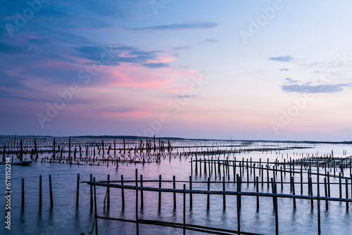 Sunset view of the Z-shaped Oyster sheds in front of Guanhai House in the Qigu Lagoon of Tainan, Taiwan.  photo