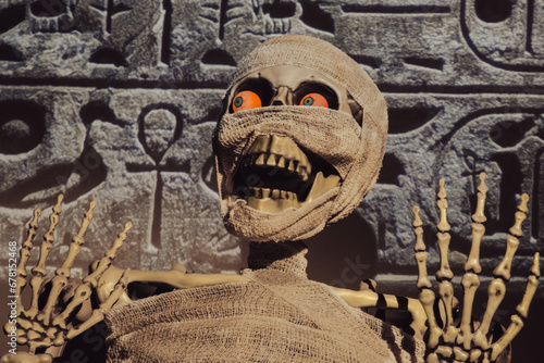 Egyptian mummy awakens. The curse of the pharaohs or the mummy's curse for thieves and archaeologists, is claimed to cause bad luck, illness, or death. It's also a Symbol of horror and Halloween.   