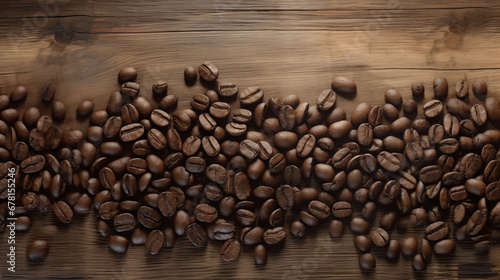 Scattered coffee beans on old wooden table top. Coffee background. © Old Man Stocker