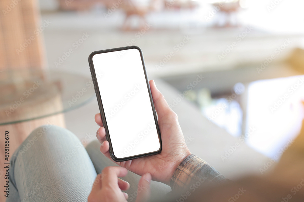 cell phone blank white screen mockup.hand holding texting using mobile on desk at office.background empty space for advertise.work people contact marketing business,technology - obrazy, fototapety, plakaty 