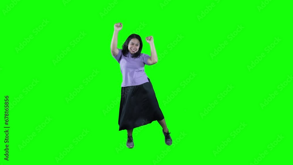 Happy young asian overweight woman dancing on green screen Happy young asian overweight woman dancing on green screen