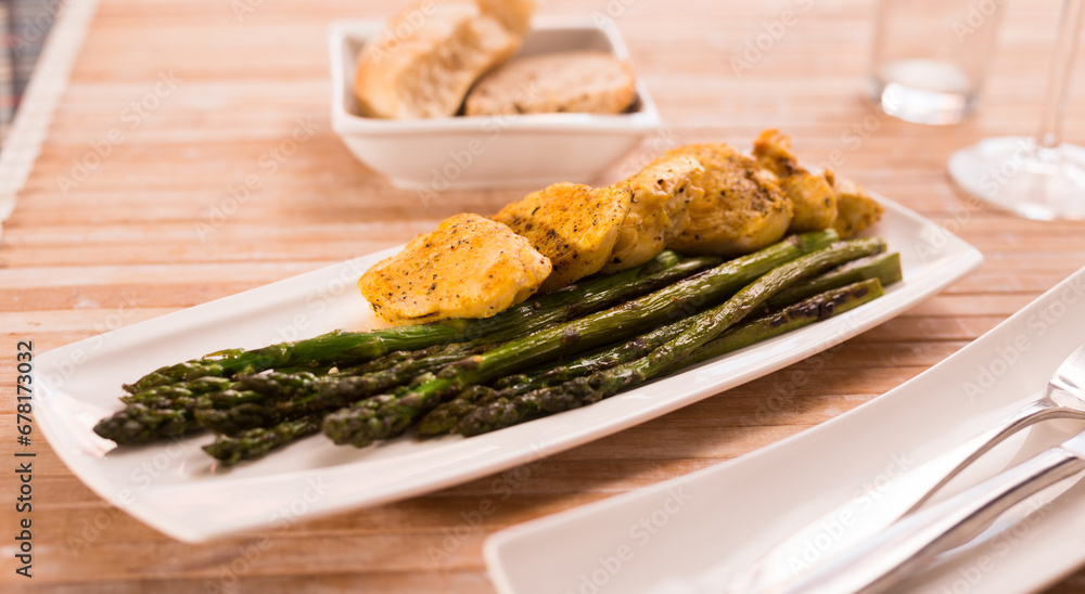 Dietary meal rich in protein. Stir fried chicken breast and green asparagus Dietary meal rich in protein. Stir fried chicken breast and green asparagus