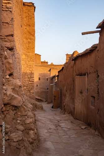 Orange medieval mud buildings in the village of Ait Ben Haddou in an oasis of the Sahara Desert
