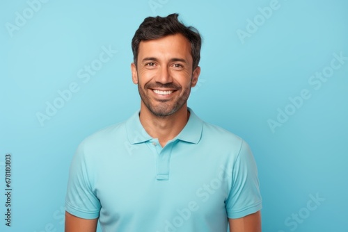 Portrait of a cheerful man in his 30s wearing a sporty polo shirt against a pastel blue background. AI Generation