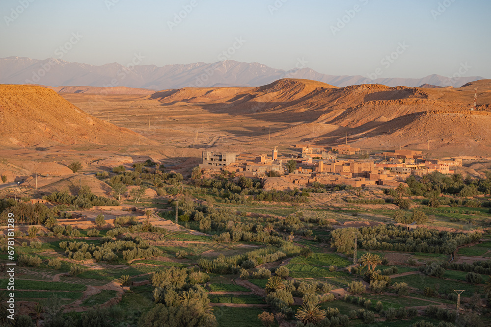 Village in the green fertile riverbed of the Draa river in the Sahara Desert with typical architecture Village in the green fertile riverbed of the Draa river in the Sahara Desert with typical architecture