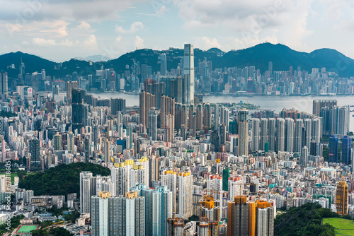 Panorama aerial view of Hong Kong Kowloon's crowded buildings and Victoria Harbour in China. photo