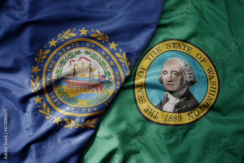 big waving colorful national flag of washington state and flag of new hampshire state . © luzitanija