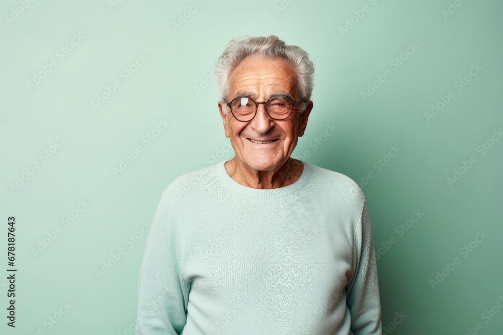 Portrait of a happy elderly man in his 90s showing off a lightweight base layer against a pastel green background. AI Generation Portrait of a happy elderly man in his 90s showing off a lightweight base layer against a pastel green background. AI Generation