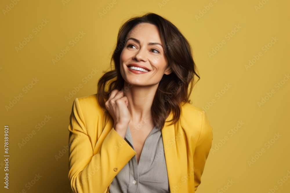 Portrait of a blissful woman in her 40s dressed in a polished vest against a soft yellow background. AI Generation Portrait of a blissful woman in her 40s dressed in a polished vest against a soft yellow background. AI Generation