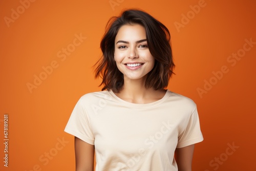Portrait of a satisfied woman in her 20s dressed in a casual t-shirt against a soft orange background. AI Generation