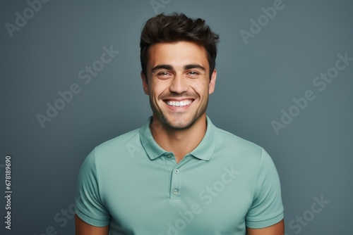 Portrait of a cheerful man in his 20s wearing a sporty polo shirt against a soft gray background. AI Generation