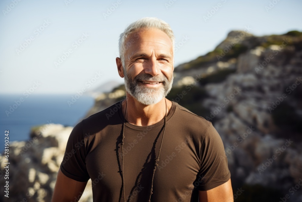 Portrait of a happy man in his 60s dressed in a casual t-shirt against a rocky cliff background. AI Generation Portrait of a happy man in his 60s dressed in a casual t-shirt against a rocky cliff background. AI Generation