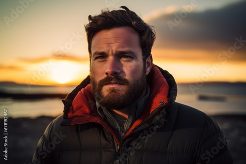Portrait of a content man in his 30s donning a durable down jacket against a vibrant beach sunset background. AI Generation