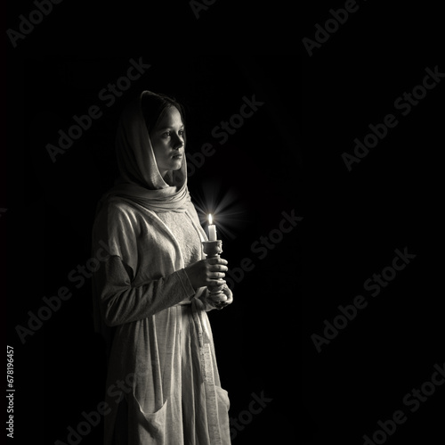 Young girl with candles in her hands
