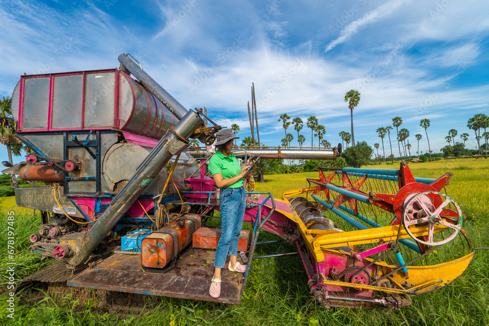 Modern farmer woman use tablet technology improve rice productivity in rice plantation field