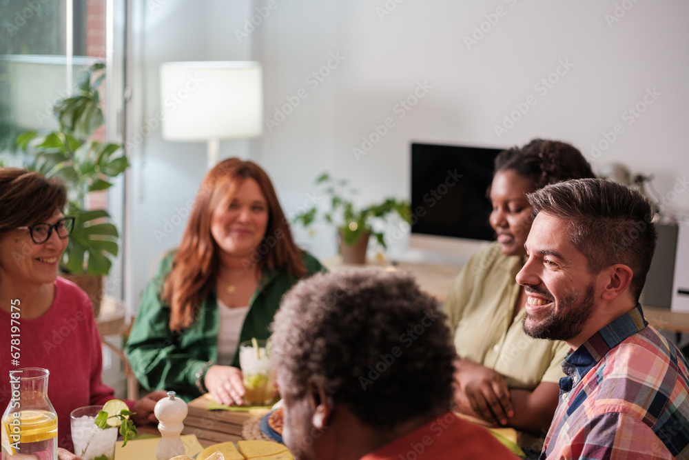 Intergenerational meeting of friends eating and celebrating together. Concept: lifestyle, together, fun Intergenerational meeting of friends eating and celebrating together. Concept: lifestyle, together, fun