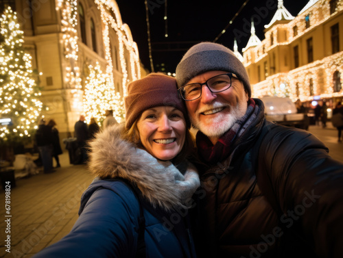 A couple take a selfie in the street on Christmas night