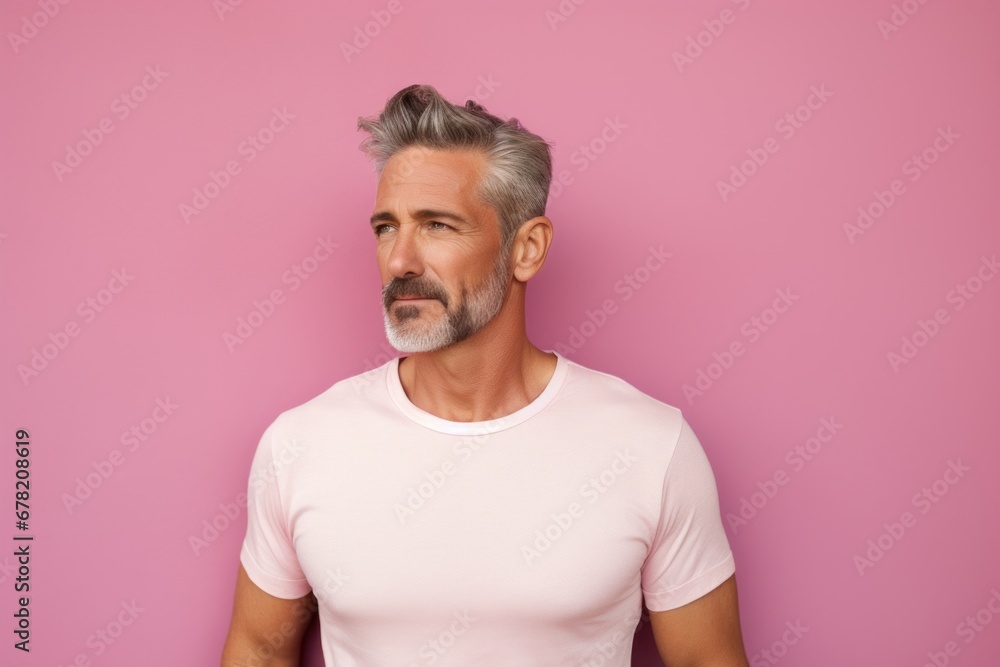 Portrait of a content man in his 40s donning a trendy cropped top against a solid pastel color wall. AI Generation
