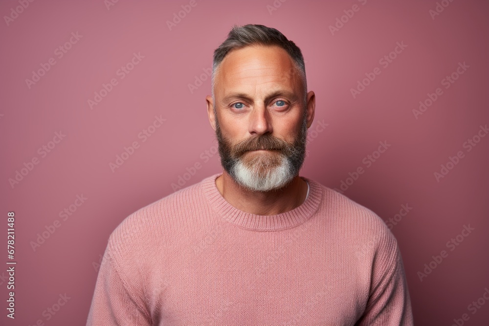 Portrait of a tender man in his 40s dressed in a warm wool sweater against a solid pastel color wall. AI Generation Portrait of a tender man in his 40s dressed in a warm wool sweater against a solid pastel color wall. AI Generation