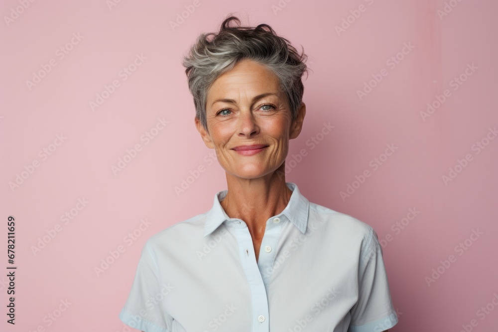 Portrait of a jovial woman in her 50s wearing a simple cotton shirt against a solid pastel color wall. AI Generation Portrait of a jovial woman in her 50s wearing a simple cotton shirt against a solid pastel color wall. AI Generation
