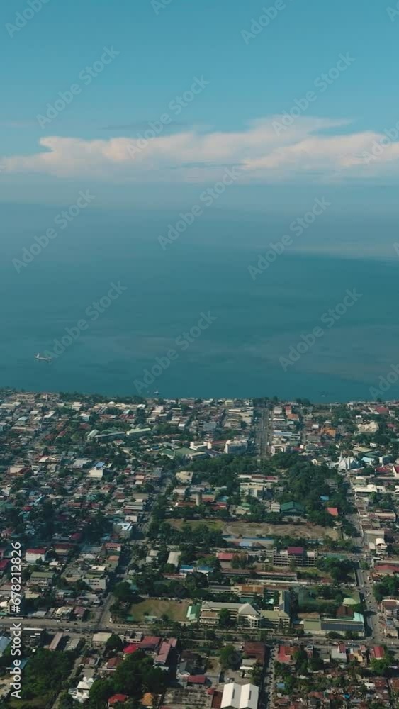 General Santos City view from above. Mindanao, Philippines. Cityscape. Vertical view. General Santos City view from above. Mindanao, Philippines. Cityscape. Vertical view.