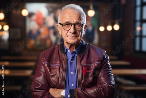 Portrait of a satisfied man in his 70s sporting a stylish varsity jacket against a empty modern loft background. AI Generation