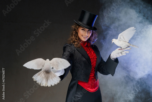Canvastavla A bewitching moment captured as a woman magician in a magician's costume and bla