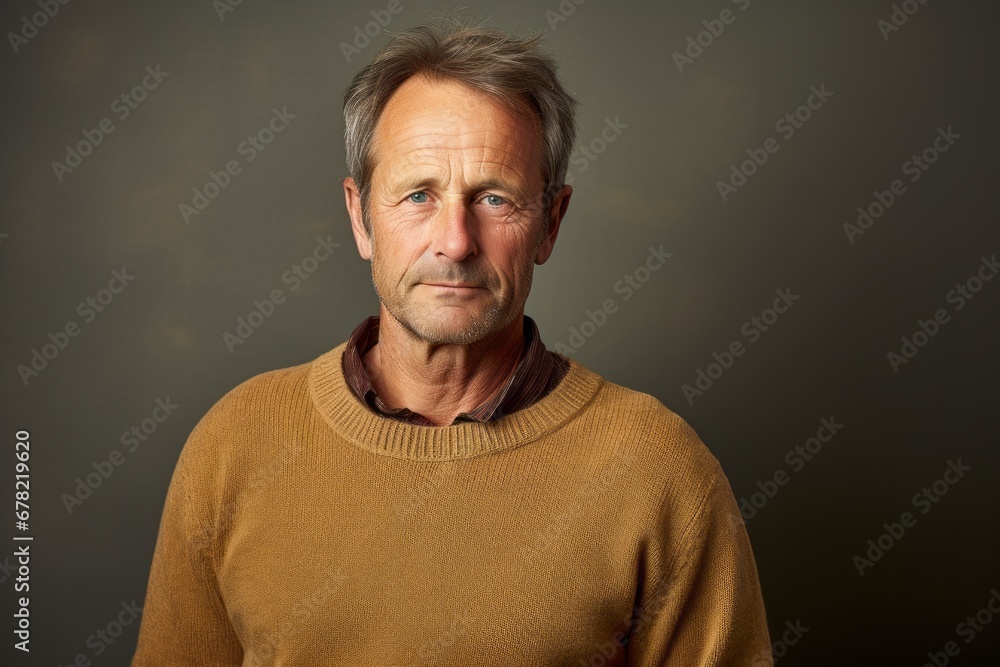 Portrait of a tender man in his 50s wearing a cozy sweater against a plain cyclorama studio wall. AI Generation Portrait of a tender man in his 50s wearing a cozy sweater against a plain cyclorama studio wall. AI Generation