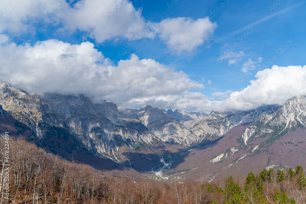 blue sky over valley among albania theth national park and mountains