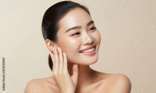 Radiant Beauty, Smiling Woman Caresses Her Flawless Face with Elegance
