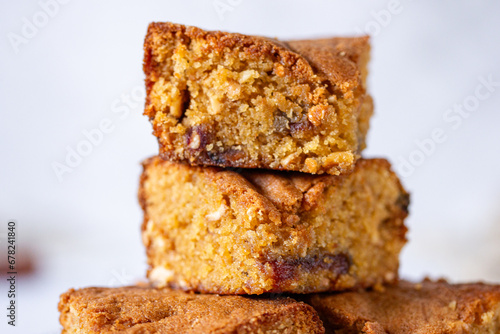 фотографія a pile of stacked slices of brown sugar cashew blondies, a vegetarian and vegan