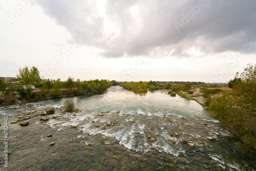 Transparent waters of Kopru River (Köprüçay, ancient Eurymedon) with its emerald green colour in Koprulu Canyon (Köprülü Kanyon) National Park, Antalya, Turkey photo