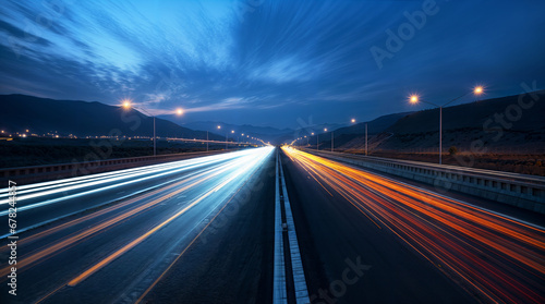 Long exposure on a straight highway road during the night, orange and blue lines