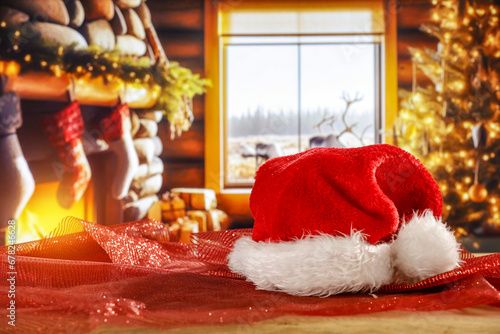 Desk of free space and santa claus hat. Home interior with fireplace and empty space for your decoration. 