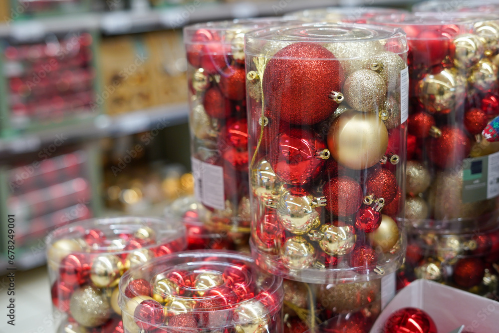 Christmas ornaments. Christmas market store - Colorful decorations red and golden balls in boxes
