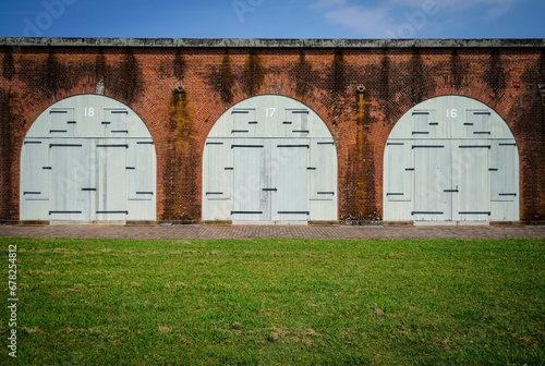 Three wooden doors at the Fort Pulaski National Monument in Cockspur Island, Georgia 
