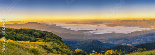 Tropical forest nature landscape view with mountain range and moving cloud mist at Kew Mae Pan nature trail, Doi Inthanon, Chiang Mai Thailand panorama photo